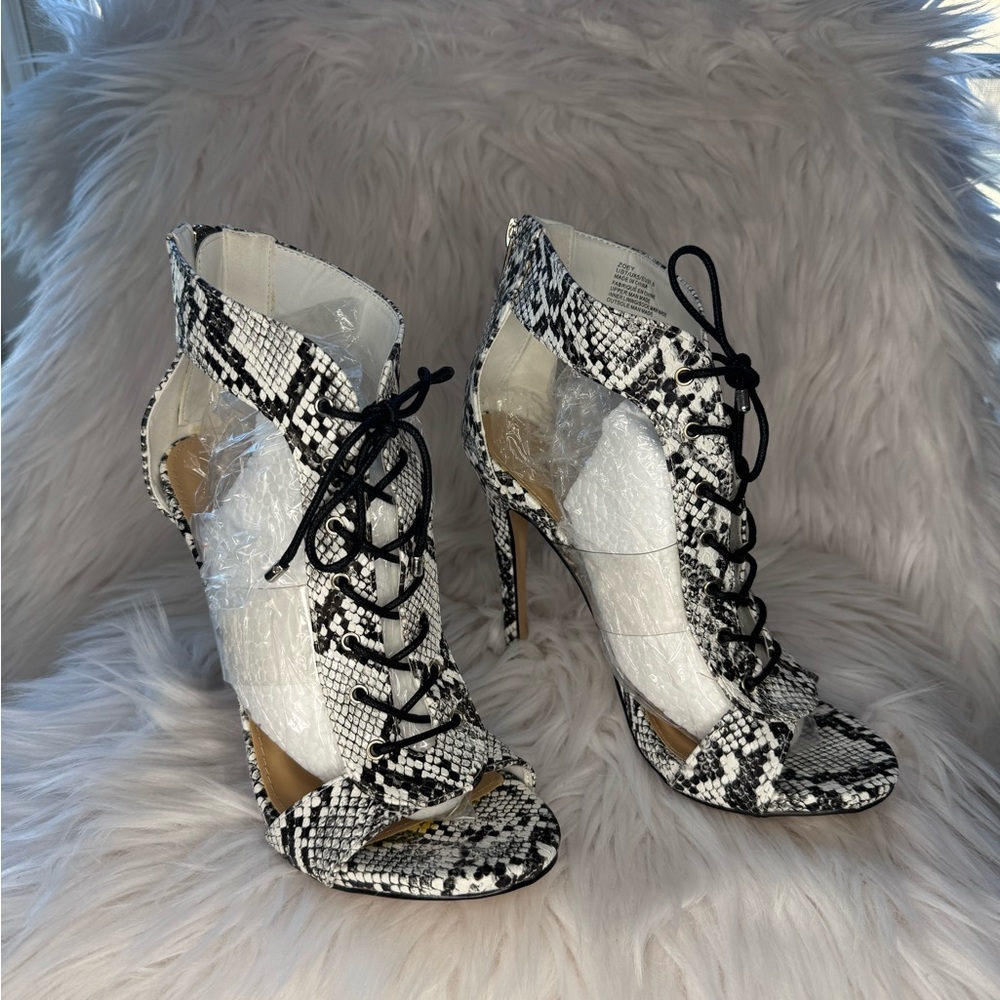 Open toe snake skin heels.